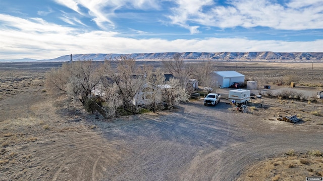 birds eye view of property featuring a mountain view