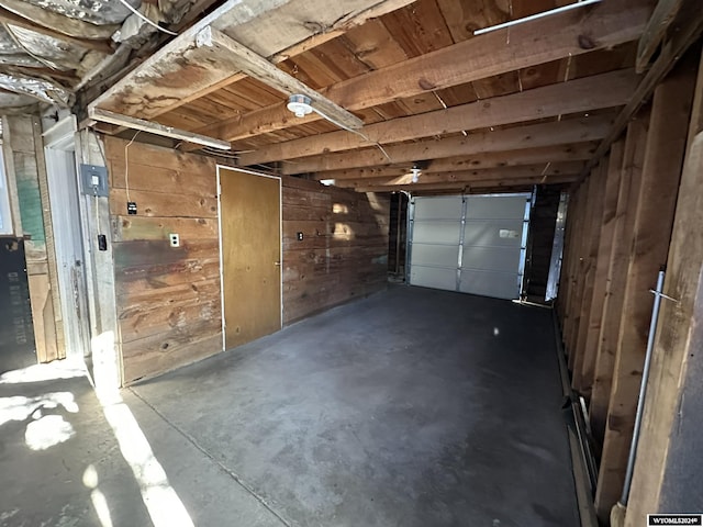 garage featuring wooden walls