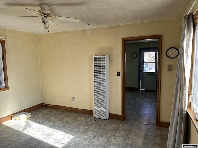 empty room featuring ceiling fan