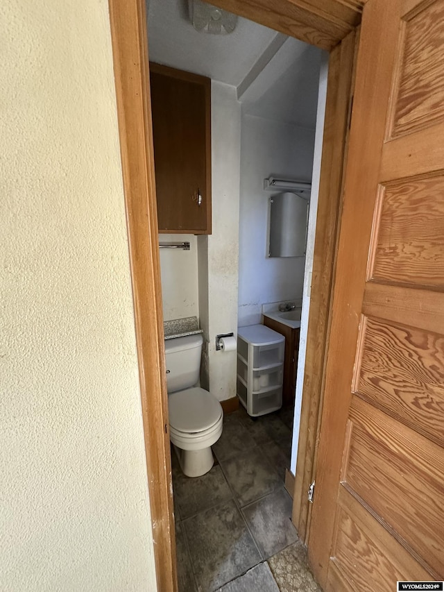 bathroom featuring tile patterned flooring and toilet