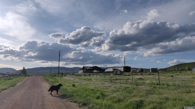 view of road with a mountain view and a rural view