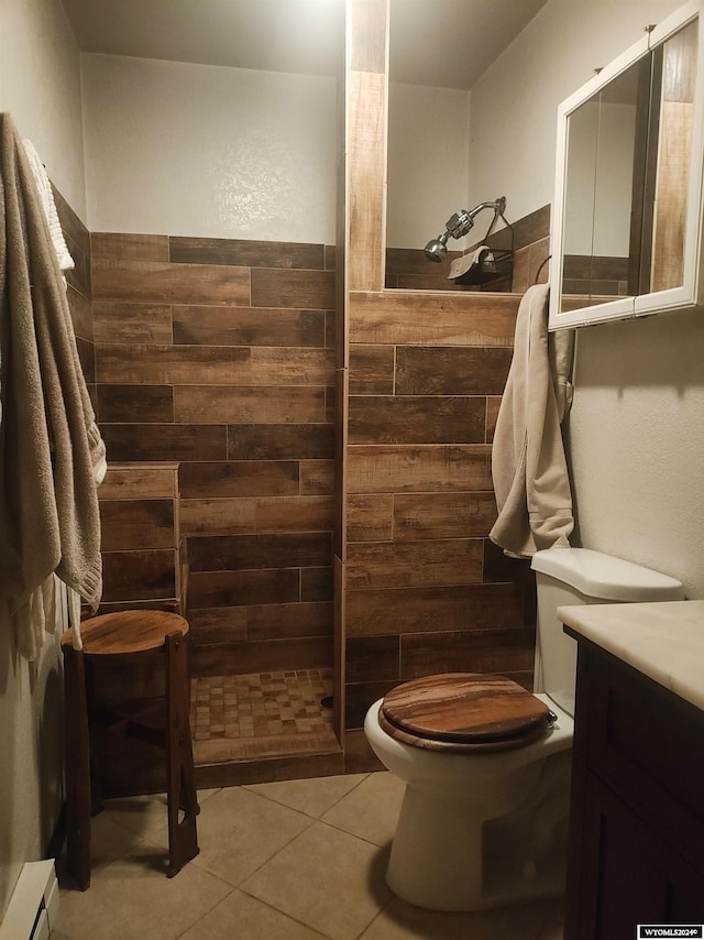 bathroom with walk in shower, vanity, wooden walls, tile patterned flooring, and toilet