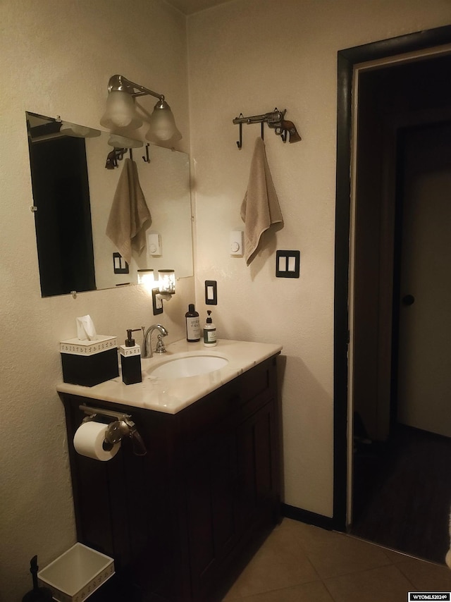 bathroom with tile patterned flooring and vanity