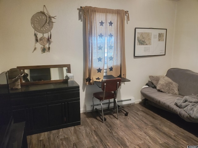 office space with wood-type flooring and baseboard heating