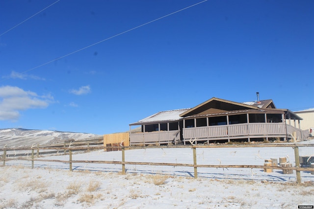 snow covered property with a mountain view