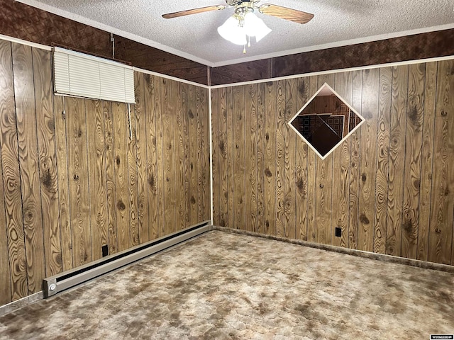 carpeted empty room featuring a textured ceiling, ceiling fan, wood walls, and baseboard heating