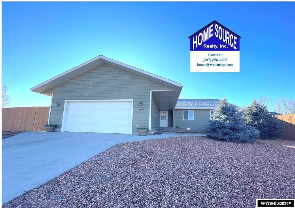 single story home featuring a garage