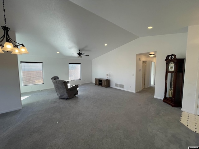 unfurnished room with dark colored carpet, ceiling fan, and lofted ceiling