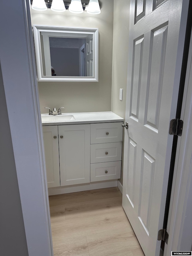 bathroom featuring vanity and hardwood / wood-style flooring