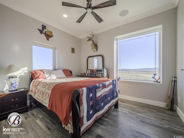 bedroom featuring ceiling fan, dark hardwood / wood-style flooring, ornamental molding, and multiple windows