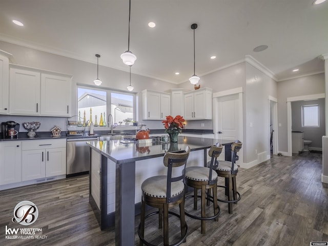 kitchen featuring dark hardwood / wood-style flooring, white cabinetry, and dishwasher