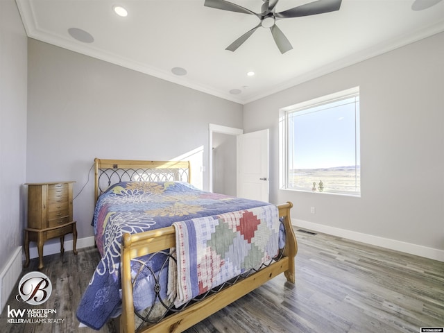 bedroom featuring ceiling fan, wood-type flooring, and ornamental molding