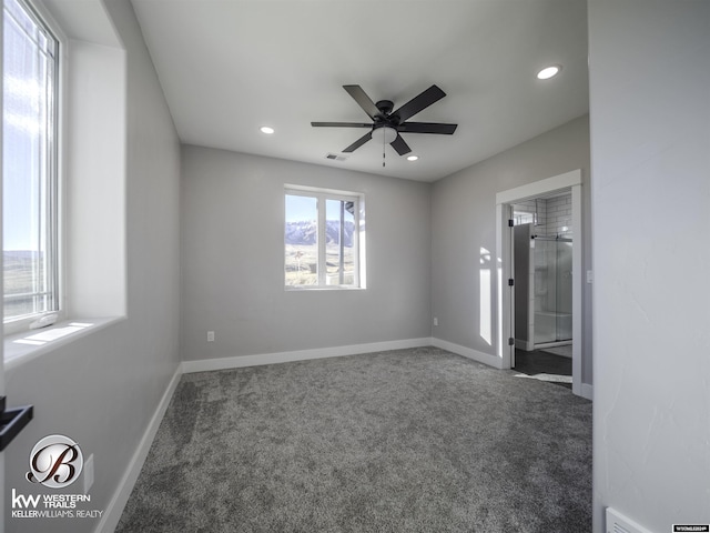 carpeted empty room with ceiling fan