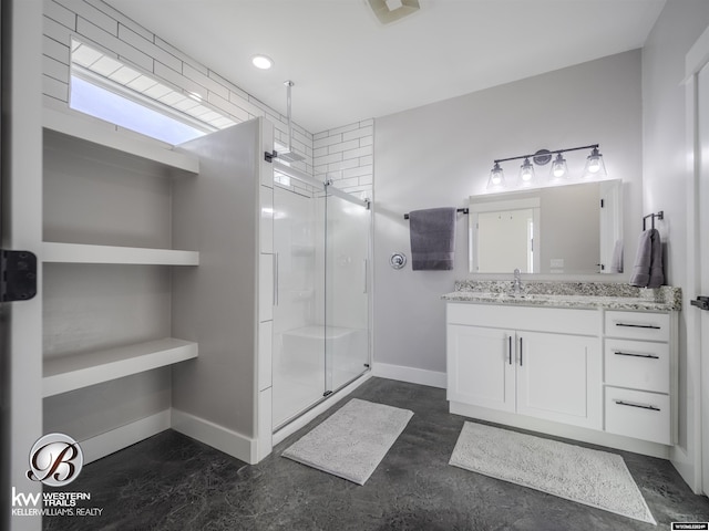 bathroom featuring vanity and a shower with door