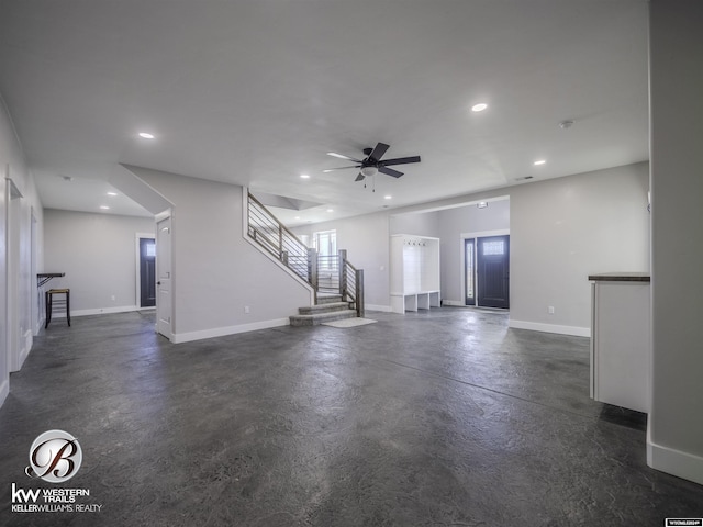 unfurnished living room featuring ceiling fan