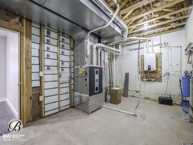 basement with tankless water heater and heating unit