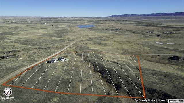 birds eye view of property featuring a mountain view