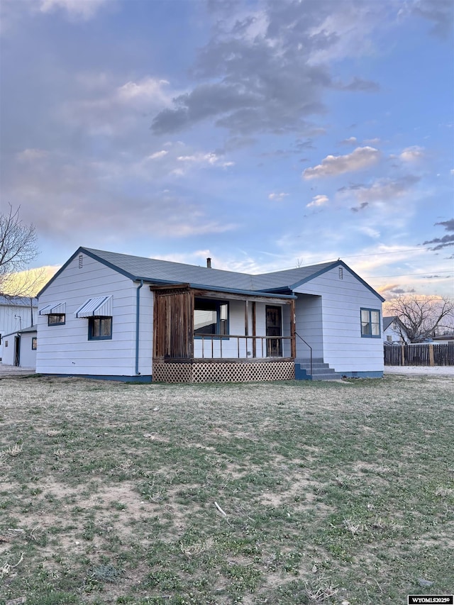 610 Charles St, Douglas, WY 82633 - view of front of home featuring a front lawn and a porch