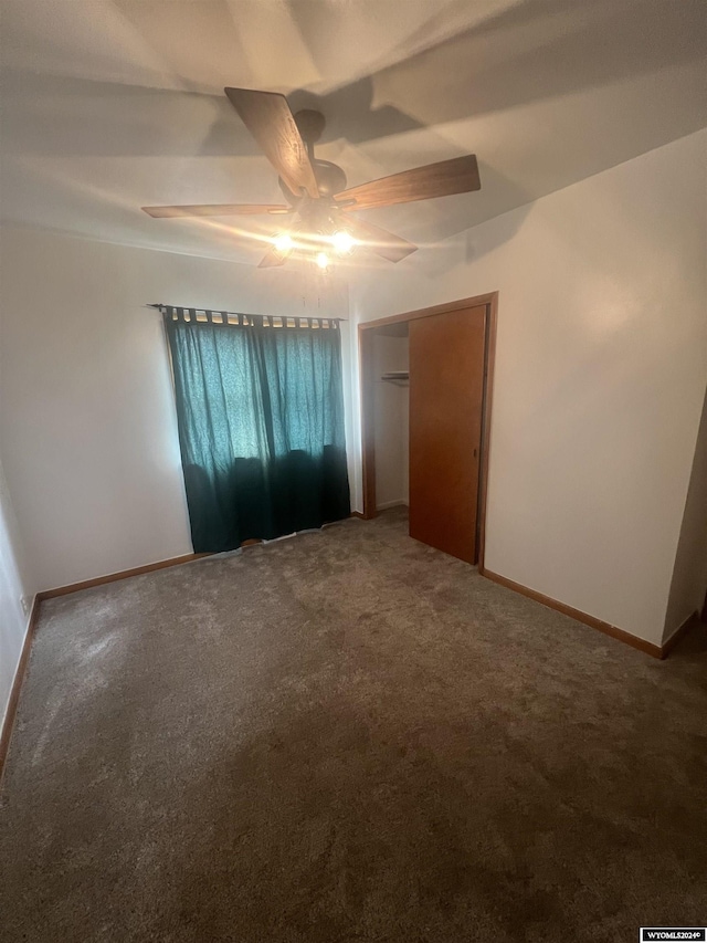 unfurnished room with carpet flooring and ceiling fan