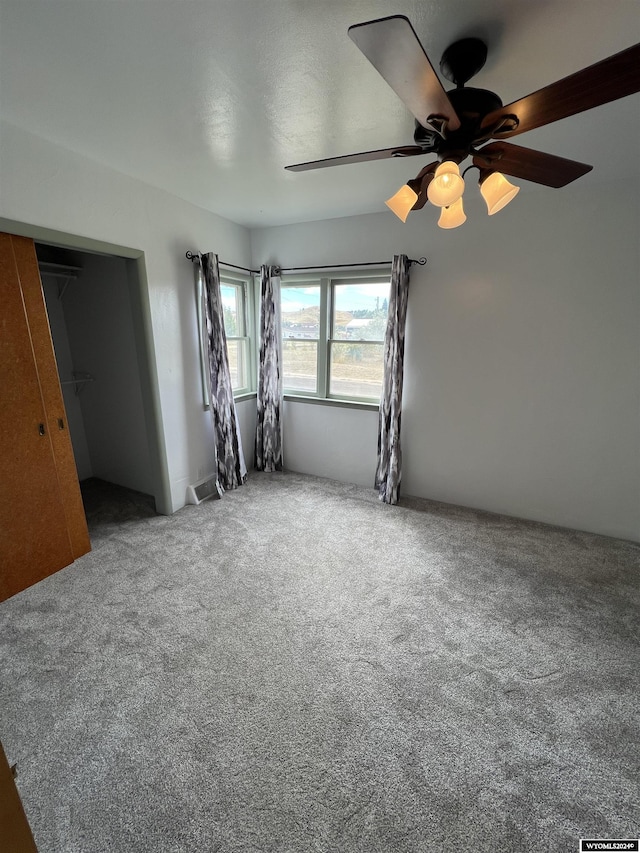 610 Charles St, Douglas, WY 82633 - unfurnished bedroom featuring carpet and ceiling fan