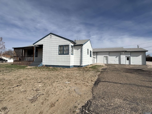 610 Charles St, Douglas, WY 82633 - view of front facade with an outdoor structure and a garage