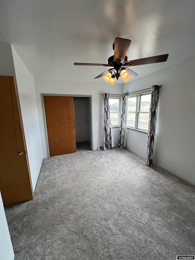 610 Charles St, Douglas, WY 82633 - unfurnished bedroom with carpet flooring, a closet, and ceiling fan