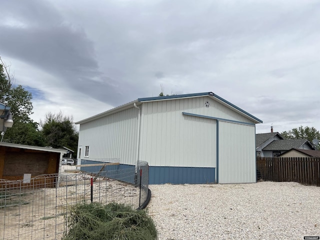 view of side of property with an outdoor structure