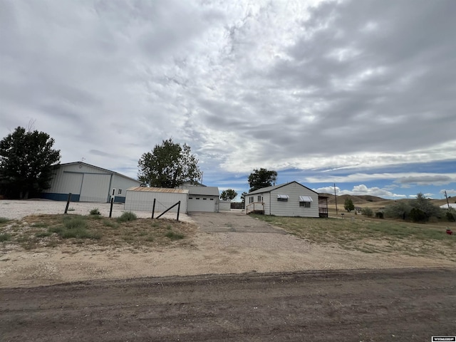 view of front facade with an outbuilding