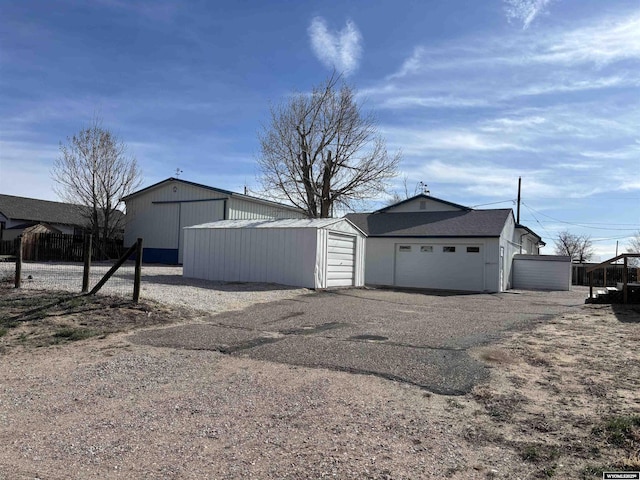 610 Charles St, Douglas, WY 82633 - view of home's exterior featuring a garage and an outdoor structure
