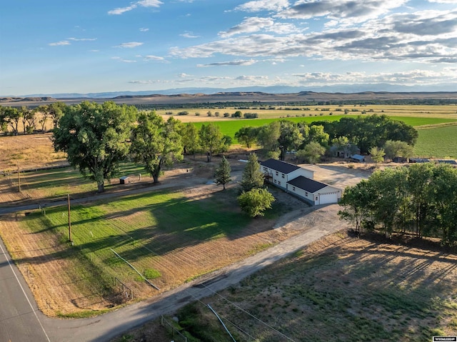 birds eye view of property featuring a mountain view and a rural view