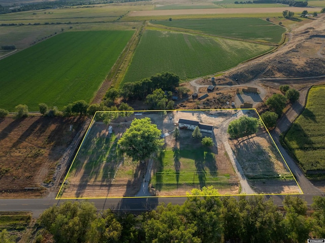 birds eye view of property featuring a water view and a rural view