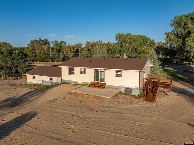 view of front of house featuring a patio area and central AC unit