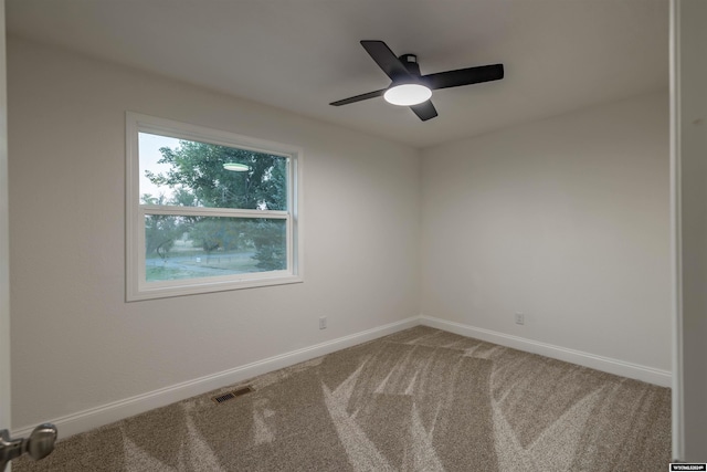 empty room with carpet floors and ceiling fan