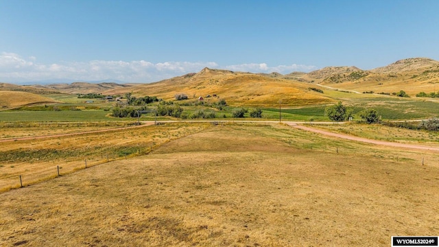 mountain view featuring a rural view