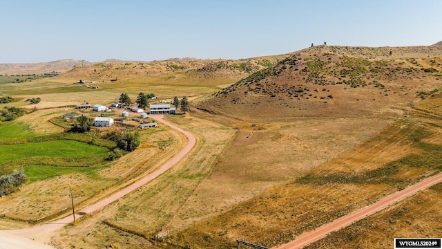 birds eye view of property with a mountain view and a rural view