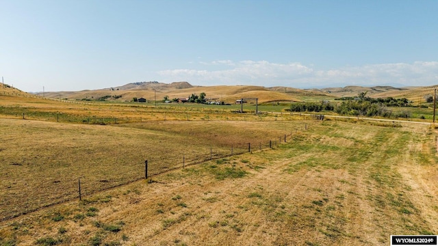 mountain view featuring a rural view