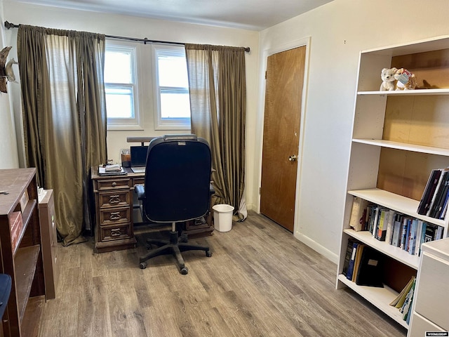 office area with hardwood / wood-style floors