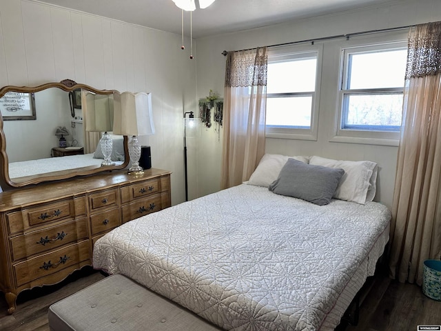 bedroom featuring dark hardwood / wood-style flooring