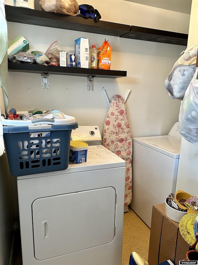 laundry room featuring washing machine and dryer