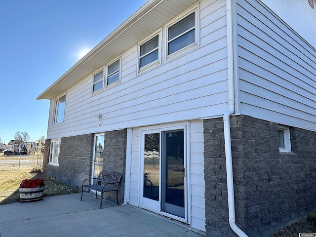 view of home's exterior with a patio