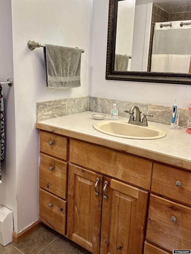 bathroom featuring tile patterned floors, vanity, and a shower with shower curtain