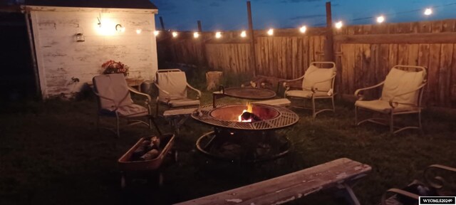 patio at twilight with an outdoor fire pit