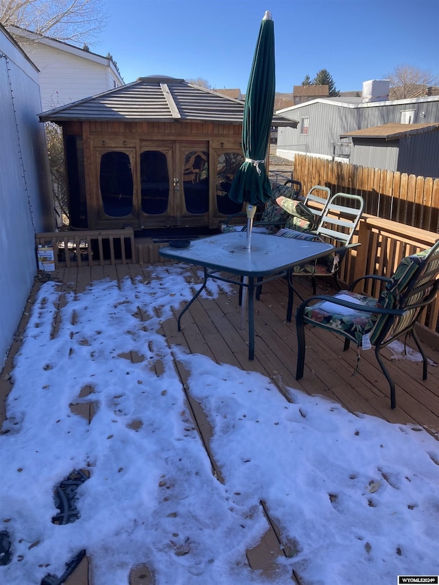 view of snow covered deck