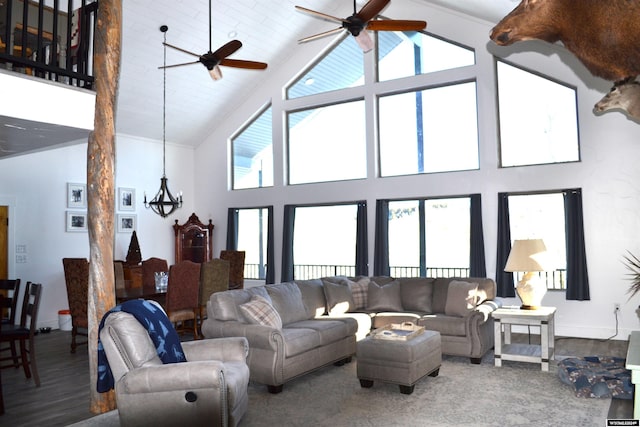 living room with ceiling fan, hardwood / wood-style floors, and high vaulted ceiling