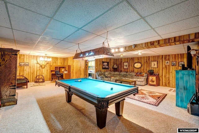 recreation room featuring pool table, carpet flooring, a drop ceiling, and wooden walls