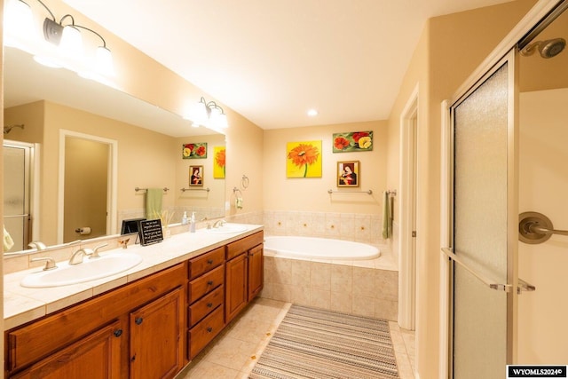 full bathroom featuring toilet, vanity, tile patterned floors, and independent shower and bath