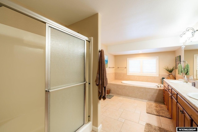 bathroom with tile patterned floors, vanity, and plus walk in shower