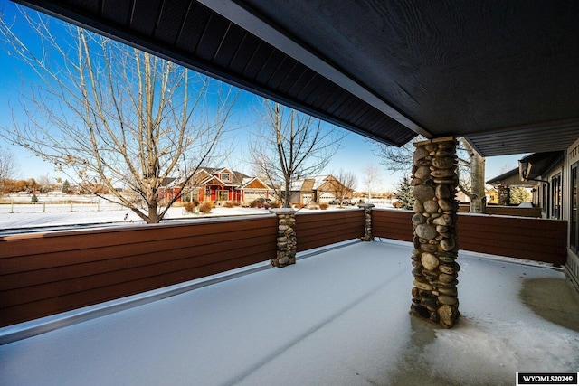 view of snow covered patio