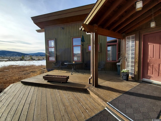 wooden terrace with a mountain view