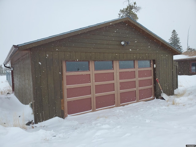 view of snow covered garage